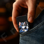 Hand holding a First dot lighter with a cartoon cat design against a dark background Smoke Tom Premium Refillable Cigarette Lighter First dot