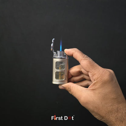 Hand holding a lighter with a visible flame against a black background, featuring the 'First Dot' brand.