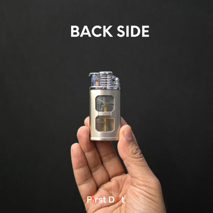 Hand holding a small metallic device labeled 'First Dot' with 'BACK SIDE' text on a black background.