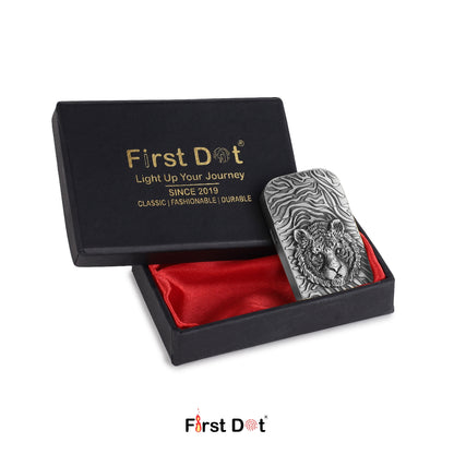 Silver tiger lighter in a black box with red interior, branded 'First Dot'.