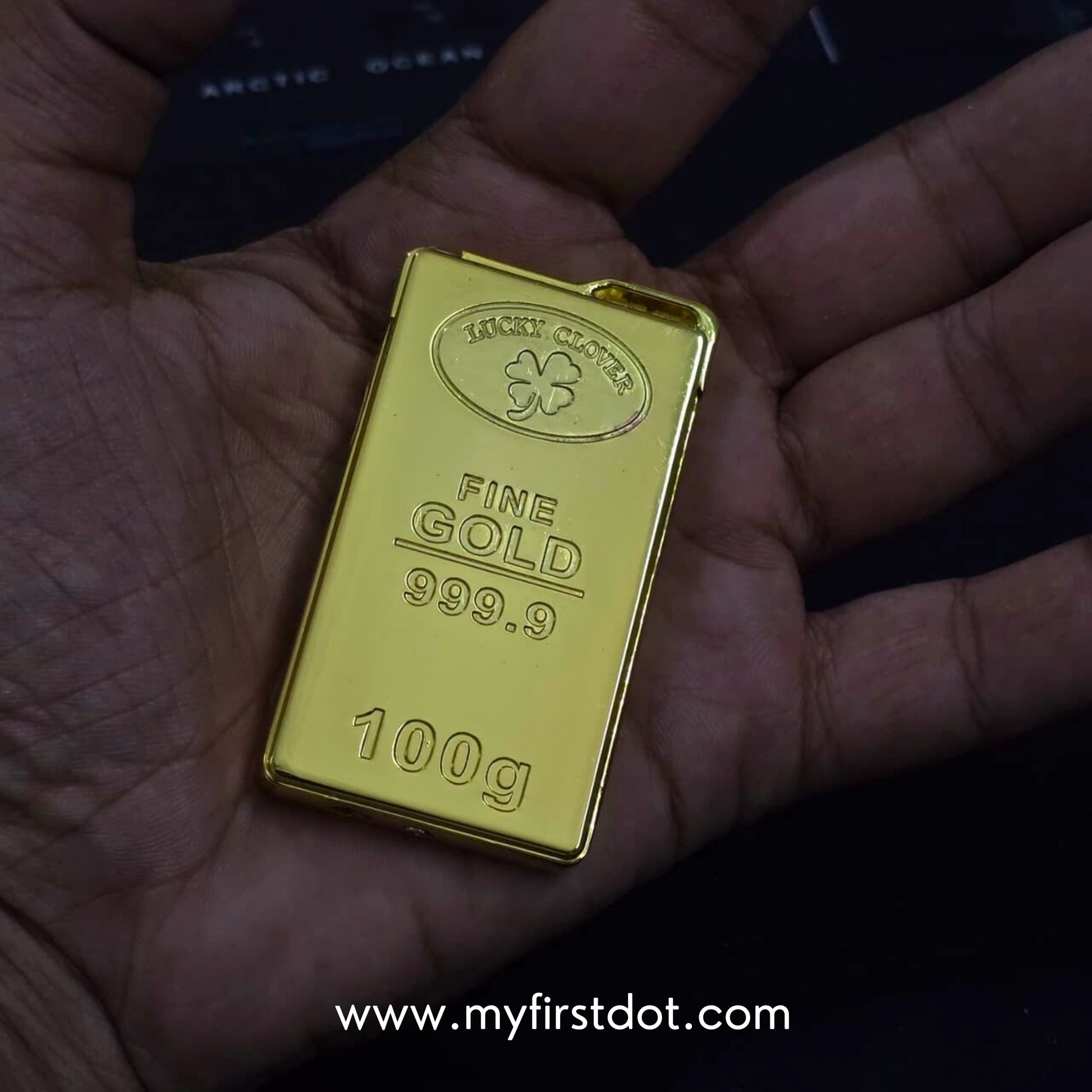 Gold bar with 'Lucky Clover' branding held in a hand first dot 100g Gold Bar Design Jet Flame Cigarette Lighter 