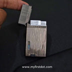 Metallic lighter on a black background with 'www.myfirstdot.com' text. Monarch Double Flame Torch Lighter Brushed Grey