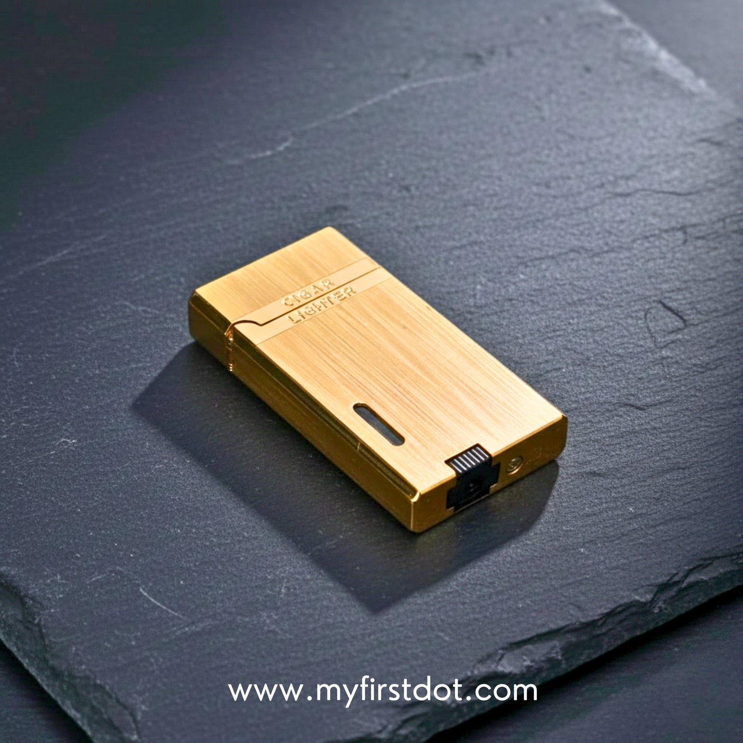 Gold lighter on a dark slate surface with 'myfirstdot.com' branding. Monarch Double Flame Torch Lighter Metallic Gold