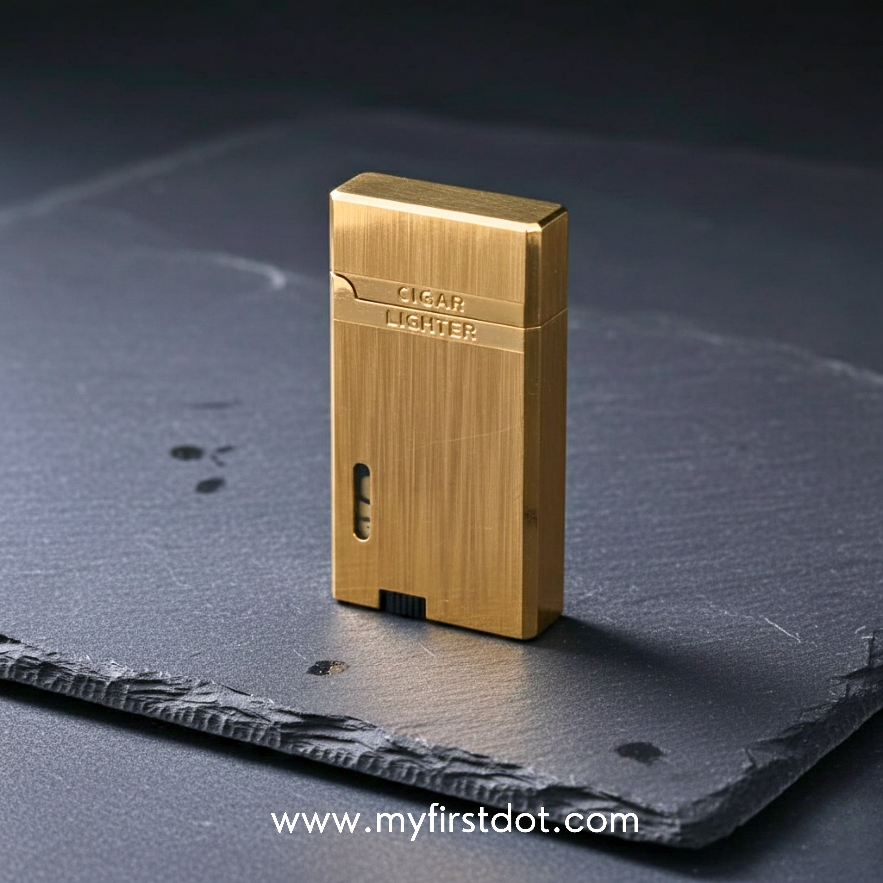 Gold lighter on a dark textured surface with 'www.myfirstdot.com' text. Monarch Double Flame Torch Lighter Metallic Gold