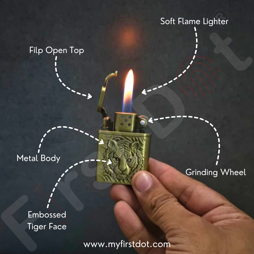Brass lighter with tiger design held by a hand, labeled features on a dark background.